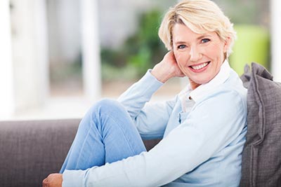 woman smiling after getting dental inlays